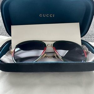 Green and red Gucci glasses